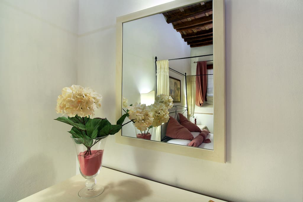 Double Bedroom with Air Conditioner, windows, Armchair, Original Tuscan wooden ceiling.