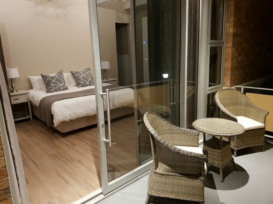 bedroom 1. beautiful neutral tones with an en-suite bathroom and balcony overlooking the gardens