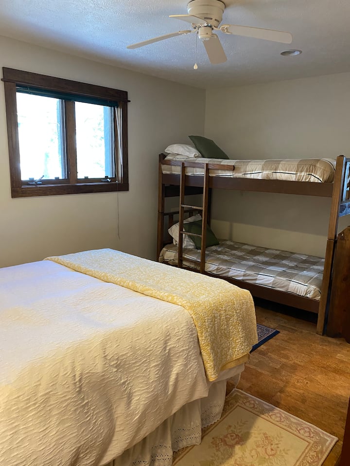 4 th room has a queen bed and a bunk bed 