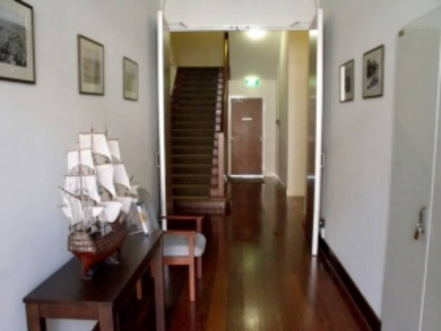 Pass an office on either side and go up the stairs to the first level. the door at the far end is to the garage and the keylock boxes are on the wall to the right of the door.