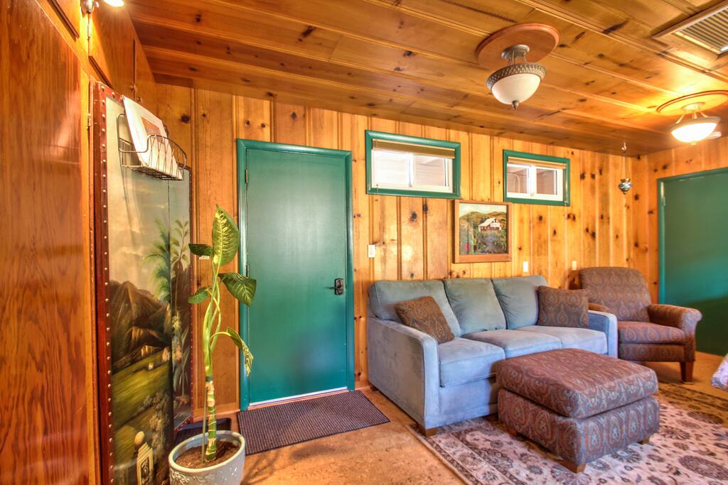 View as you exit from the bathroom. The chair in the right corner is a recliner.