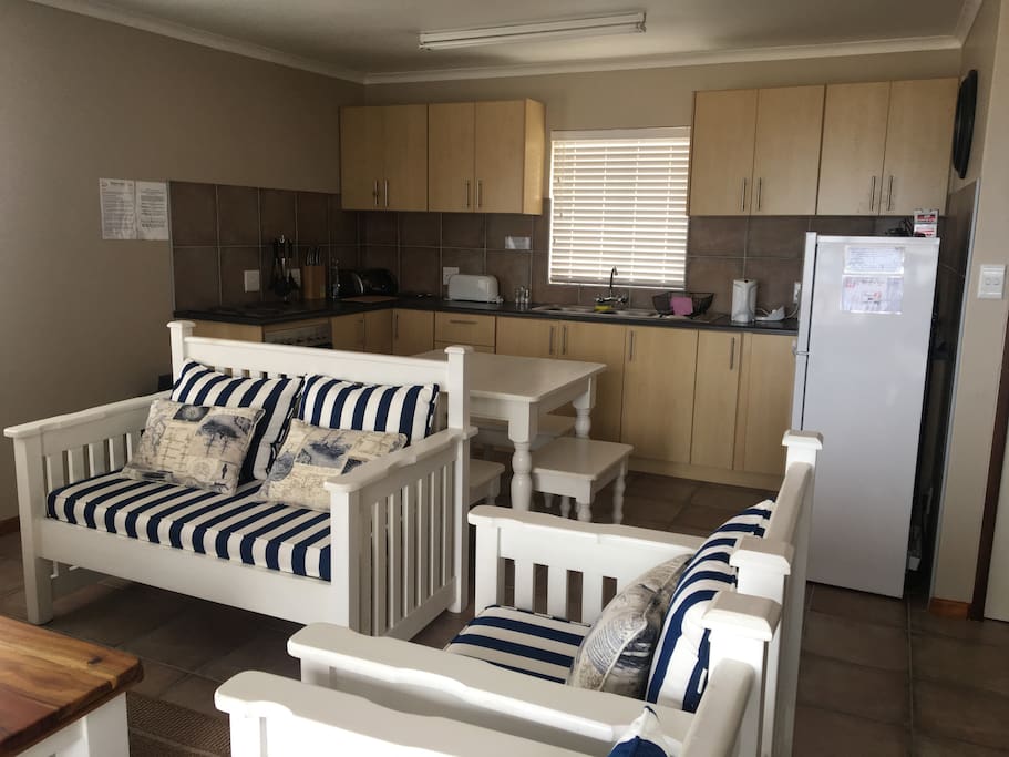Open plan kitchen, dining area, tv room