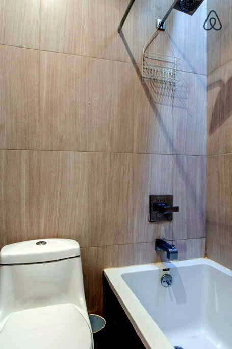 Clean Bathroom with toiletries.