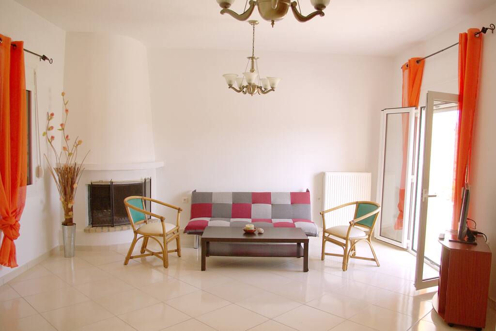Living area with TV and fireplace