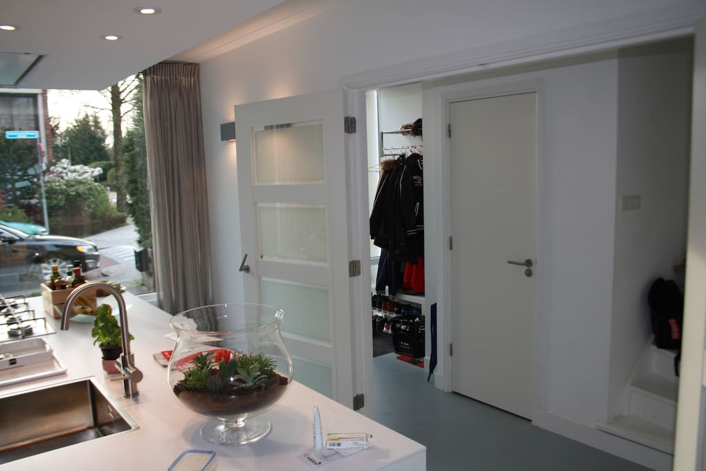 Very light house with hallway with toilet and big storage under the staircase. Double glass doors to enter livingroom