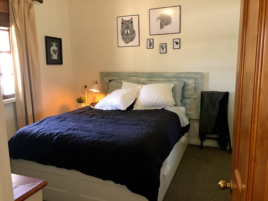 Queen sized bed in cute little renovated cottage.