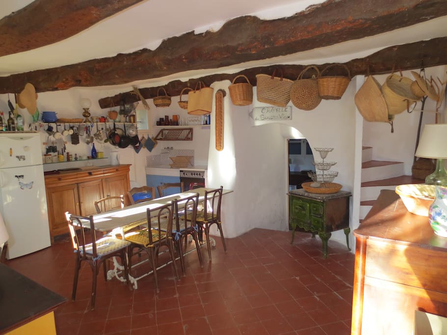 The kitchen with its antique marble table and stairs leading to the first floor.