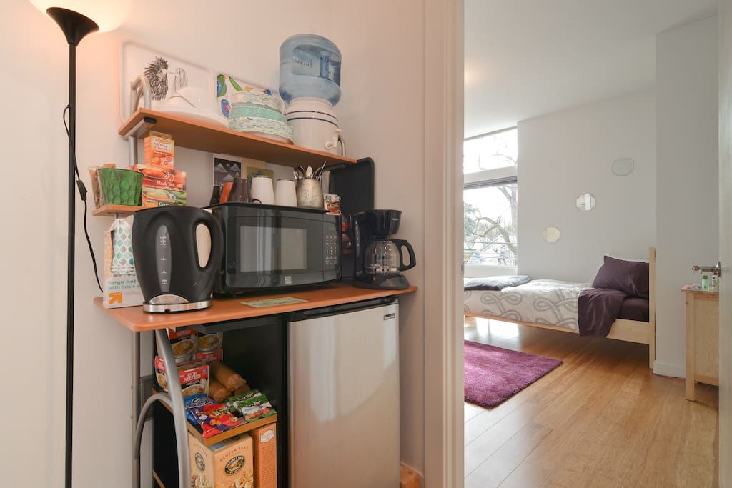 Fully stocked kitchenette steps from your room on your dedicated floor! Free coffee, tea, and snacks! Filtered water, coffee pot, hot water maker, microwave, refrigerator, and plenty of dishes. You'll feel right at home!