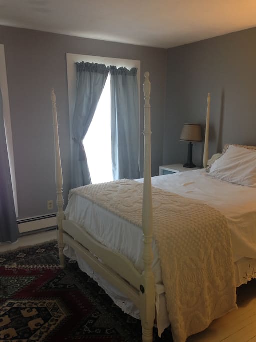 Master bedroom. Large, bright room facing the road.