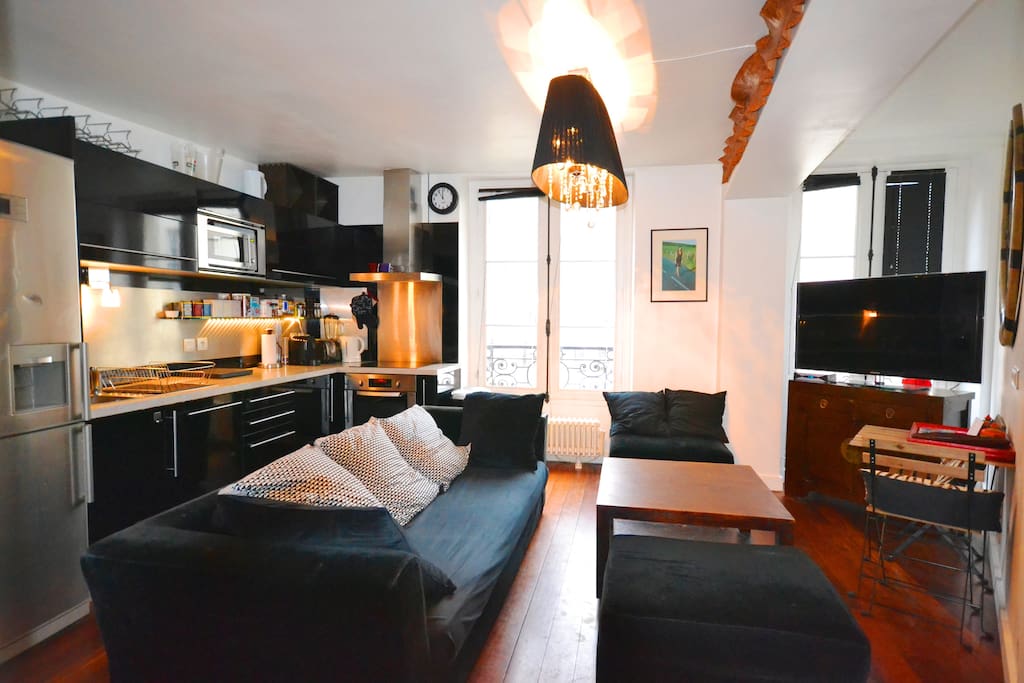 Living-room with large kitchen.