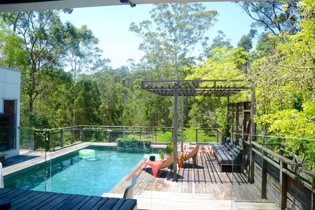 Here is the view of the pool deck and private forest taken from the kitchen.