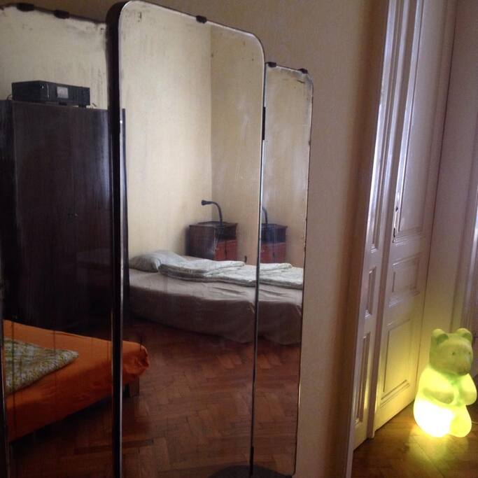 Room reflected in vintage furniture.