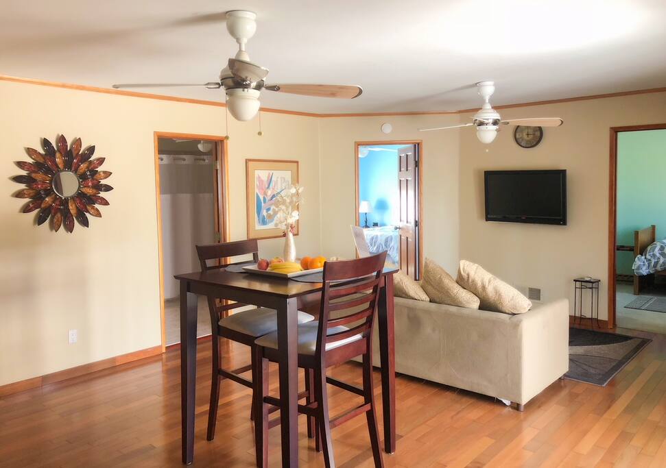 Living are with table and chairs.