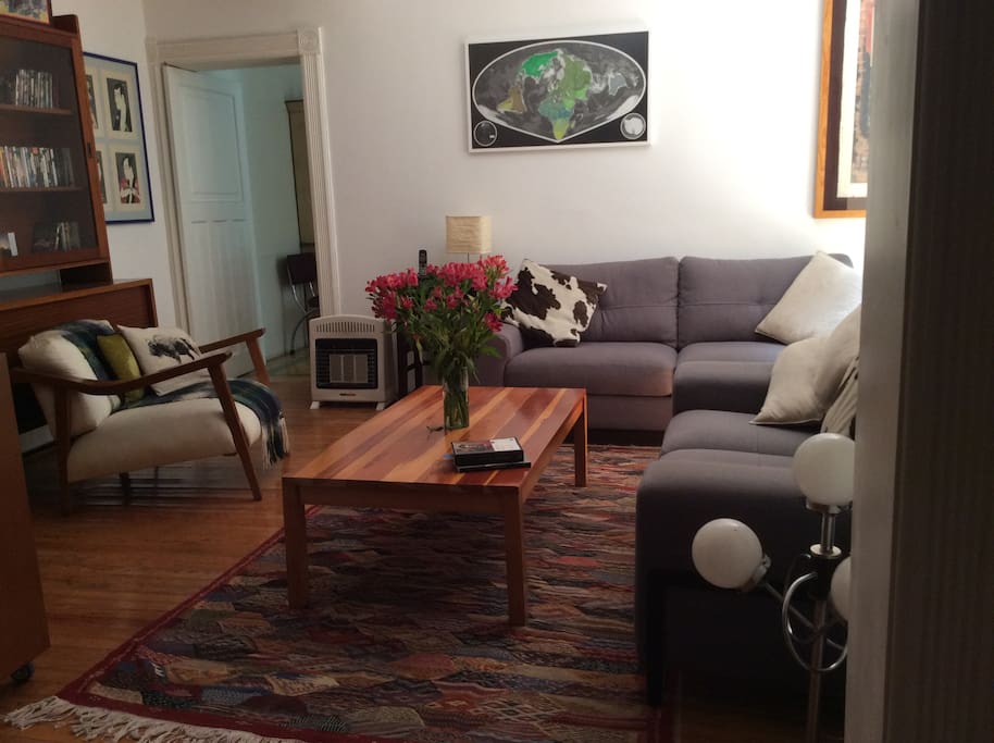 Living room, kitchen in the background