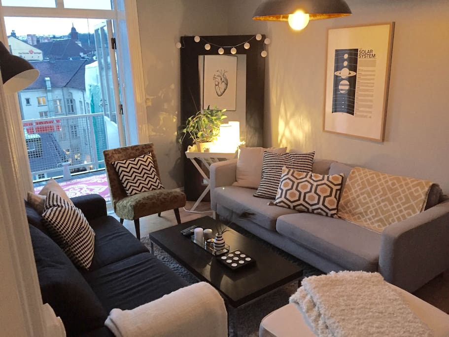 Scandinavian, modern living room, with access to large balcony