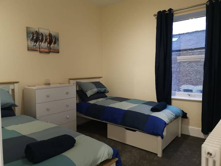 Twin bedroom with two single beds located upstairs to the front of the property.