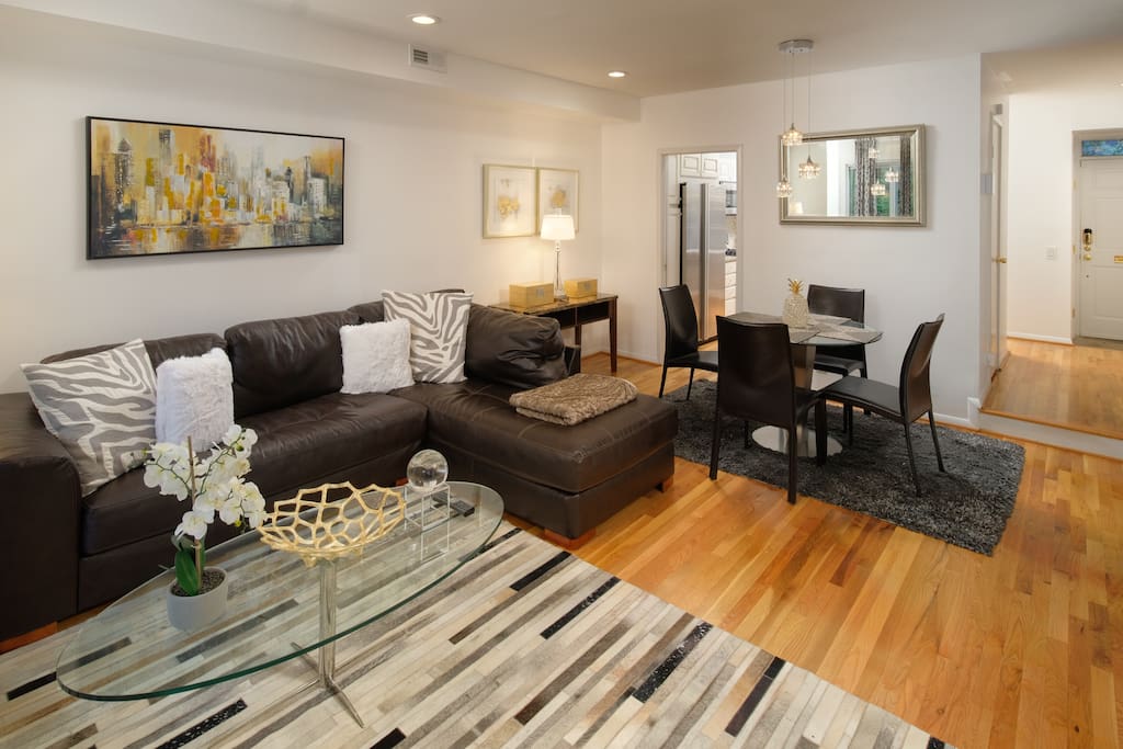 The open floor plan makes this dining room and living room space incredibly inviting.