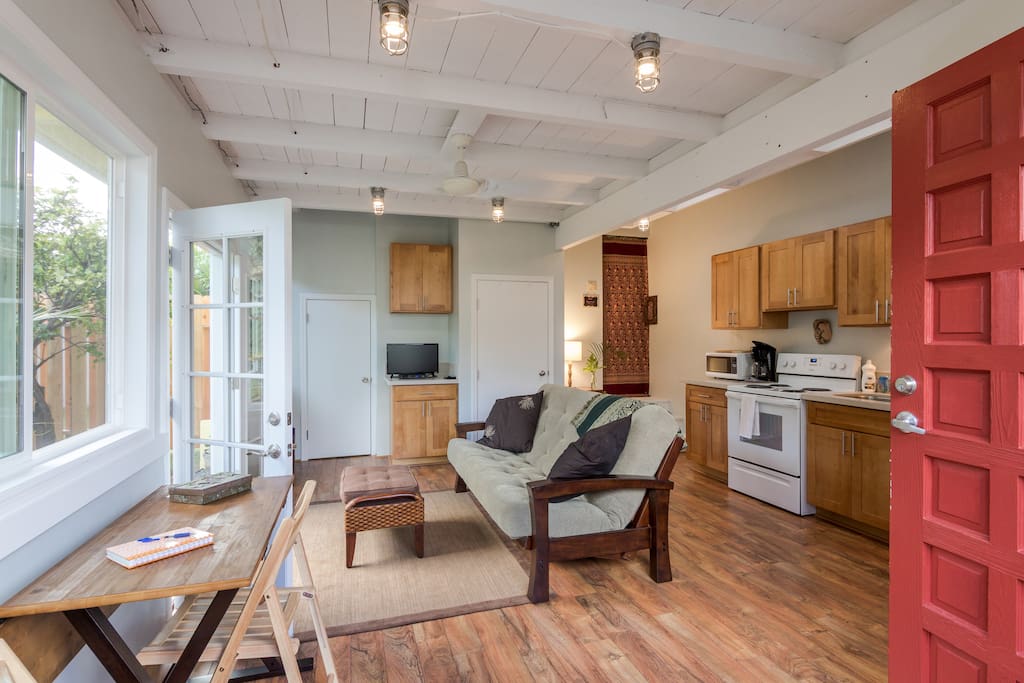 Living/kitchen area next to the bedroom and bath suite. Both suites are included in this listing. The futon becomes a double bed if needed.