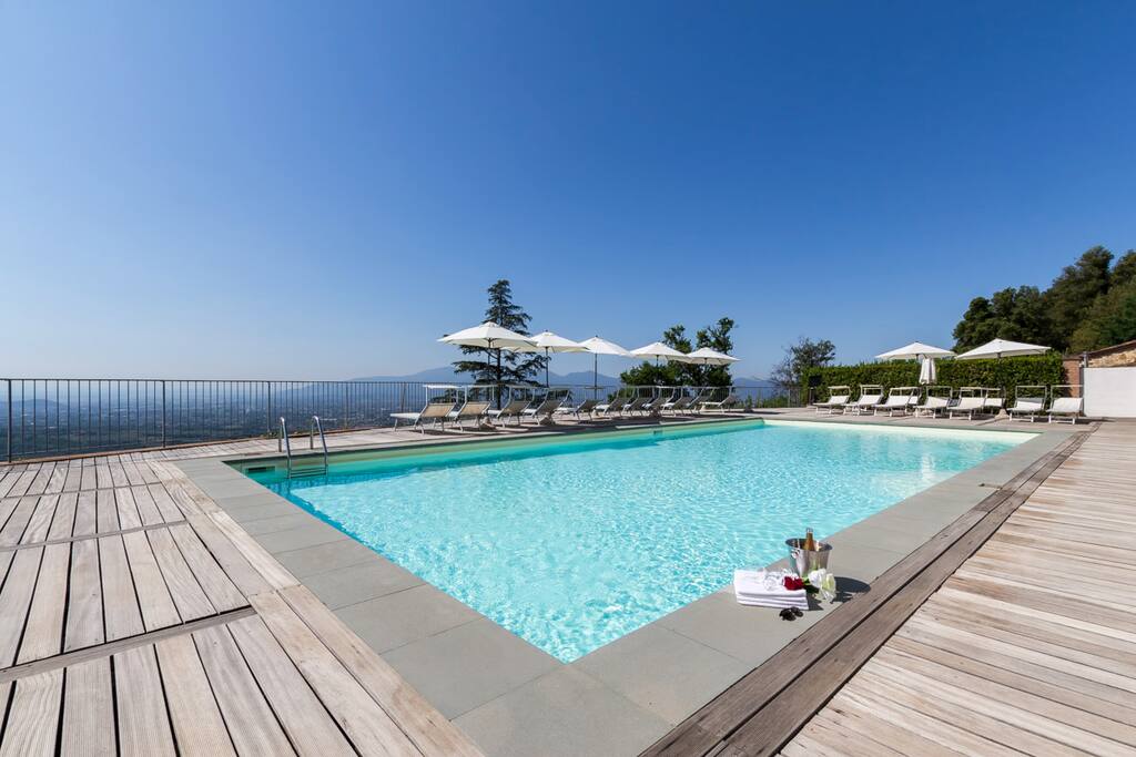 The beautiful pool has a nice terrace on the Lucca landscape