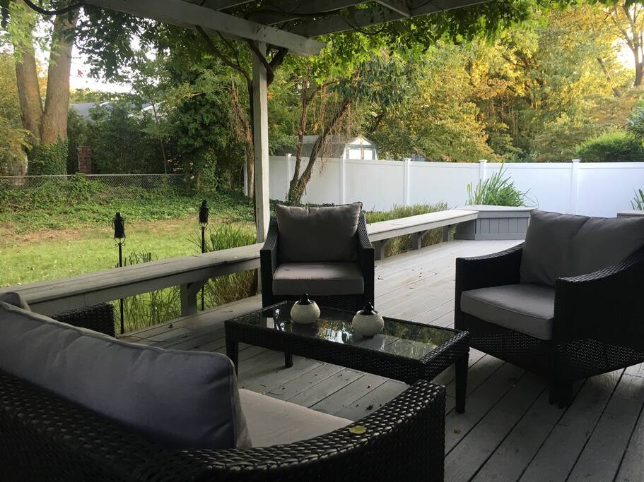 1 outside sofa 2 chairs and a wrap around bench