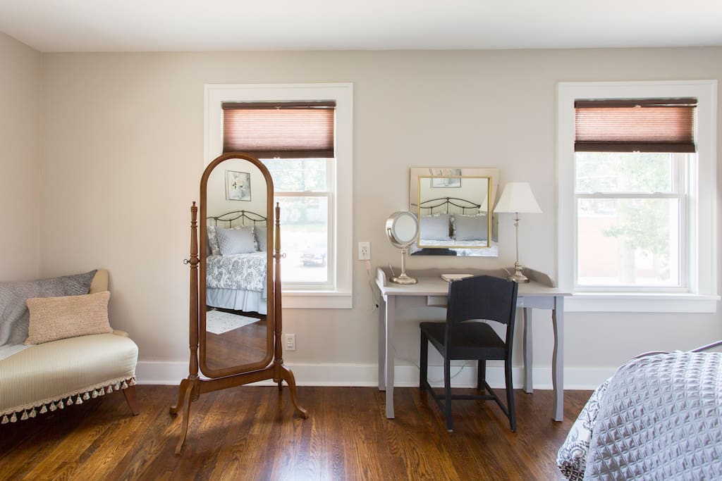 Primp at the master bedroom with a vanity with a makeup mirror and a full length mirror