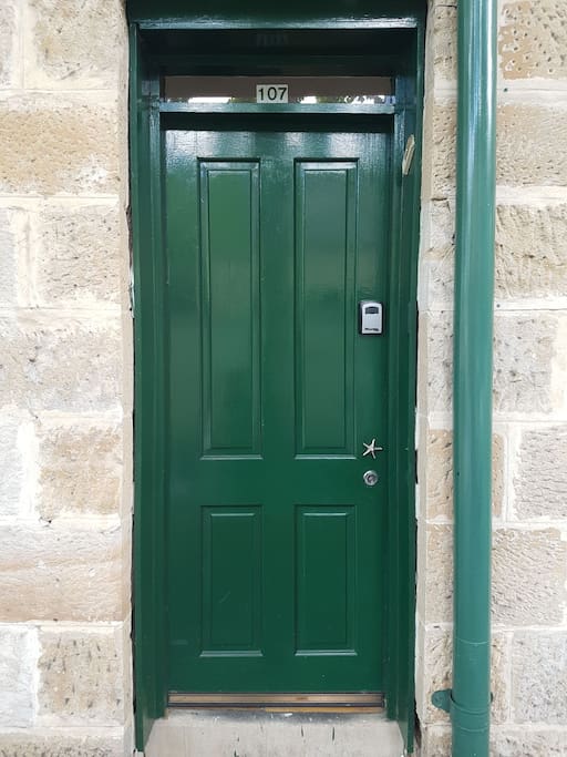 The front door. look out for the starfish door handle, 107 above the door and lockbox.