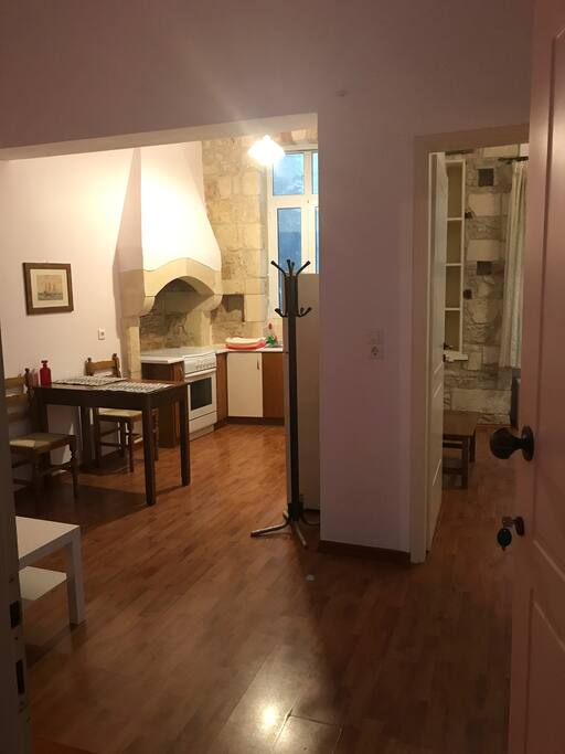 Wide angle view of the common spaces (left) and entrance to the bedroom on the right