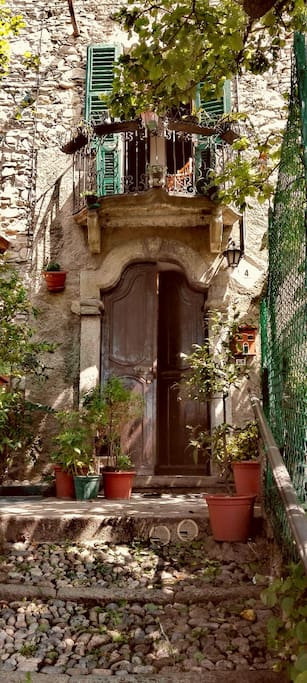 Front door of the house with the sweet little balcony