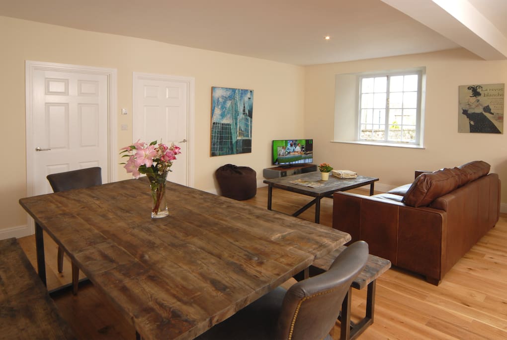 Timothy Doulton dining and coffee tables and leaher three seater sofa