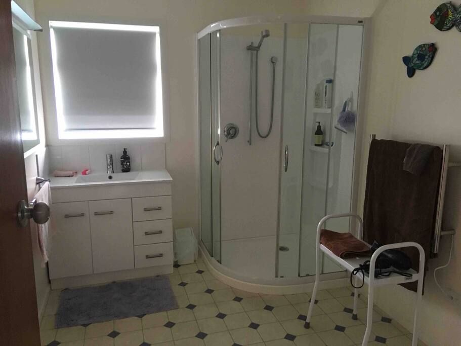 Bathroom has shower and basin with separate toilet room