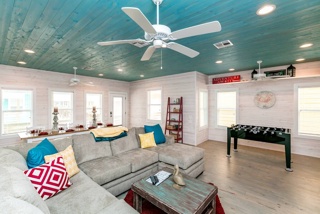 Great entertainment! Foosball table and a plush sectional in front of a flat-screen TV.