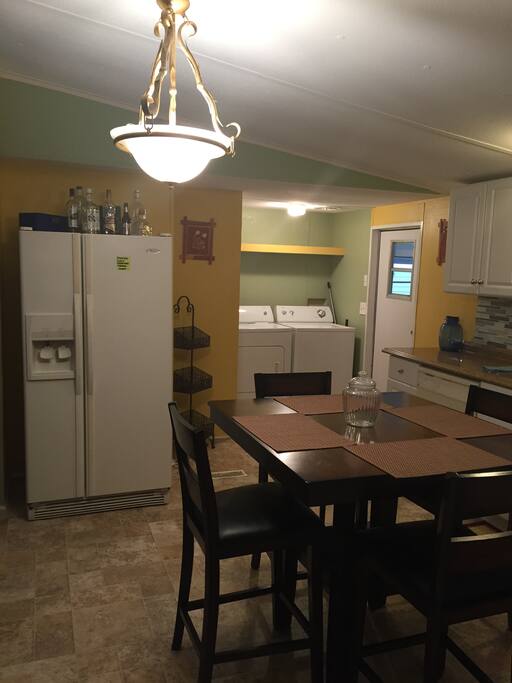 Kitchen with refrigerator and washer and dryer