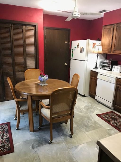 Kitchen with ice maker, toaster oven, and coffee maker.