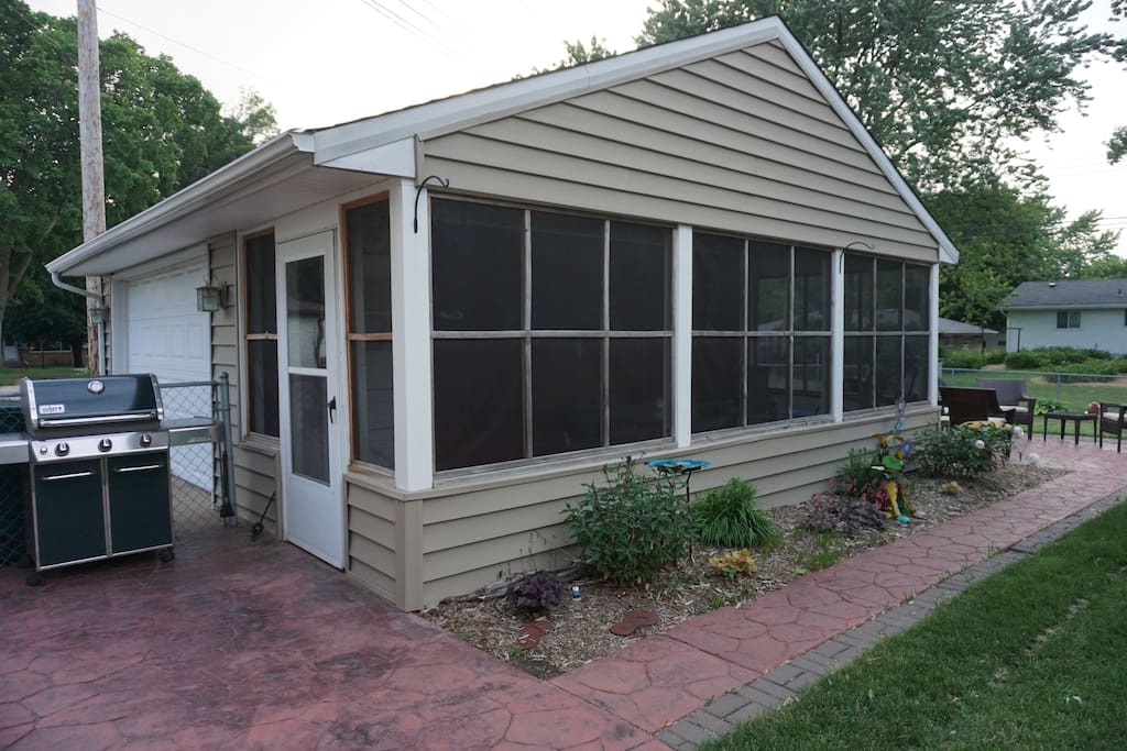 Gas Grill, Screened in porch with table and chairs, seating in back yard on patio. Great place to sit and read a book.