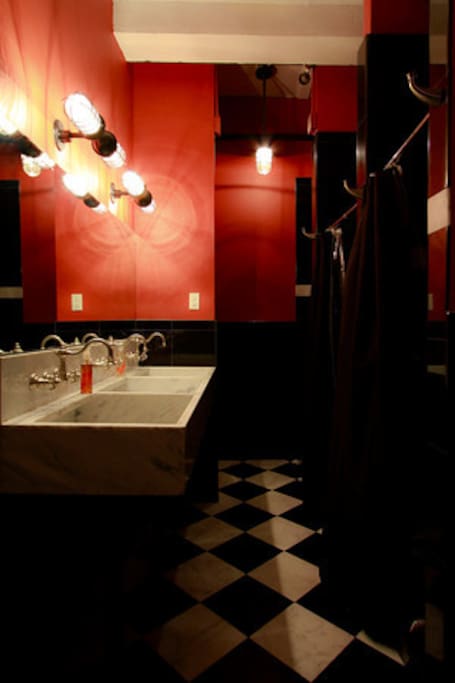 Shared bathroom has heated floors and Red Flower Organic products.