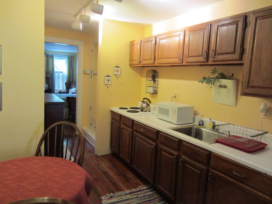 Kitchen with electric cook top, microwave, toaster and coffee maker