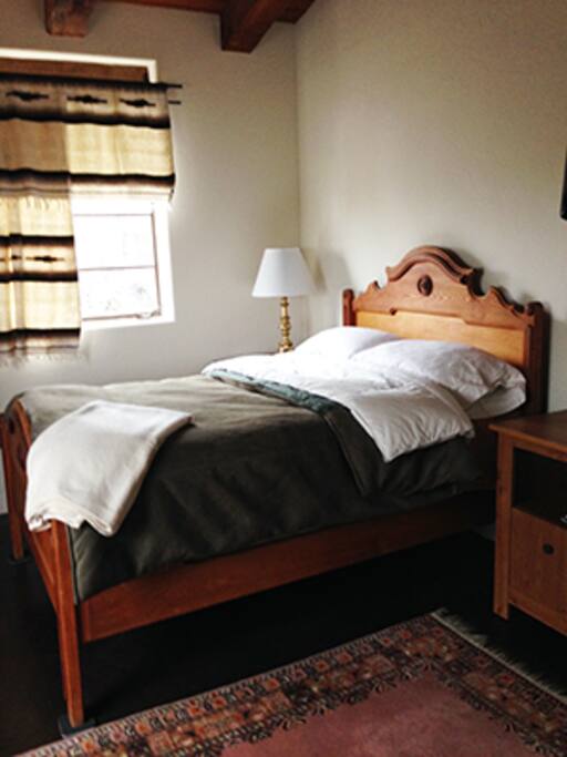 Guest room with full size bed, cable TV, plenty of closet and drawer space.