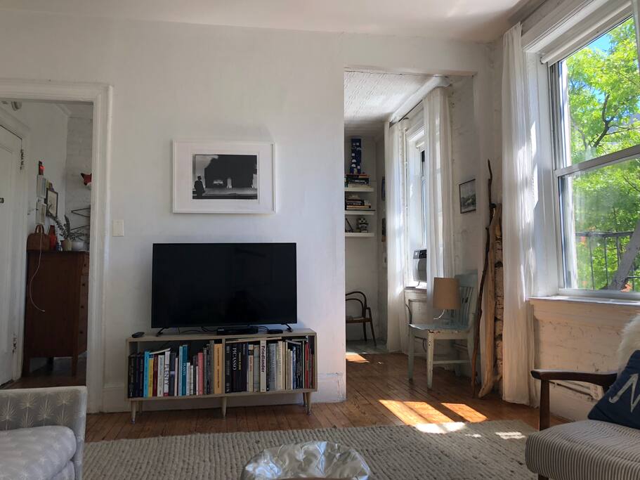 Living room looking into Dining room. TV/Netflix/Hulu/Apple TV