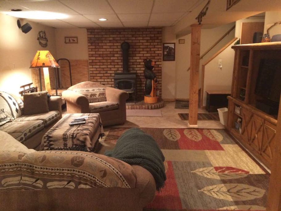 Another view of the TV room with fireplace in background & entertainment center on the right in the picture.