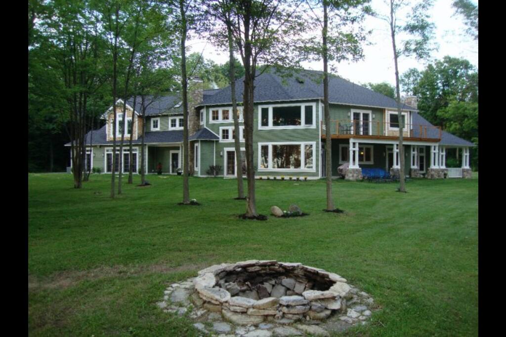 Looking back at the house from the waterfront. The limestone from the fire pit came out of the lake.