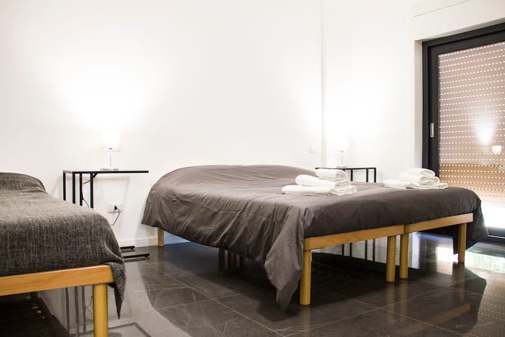 bedroom 2 - bedroom with double bed, single bed, large window with balcony; upon request they are converted into 3 single beds