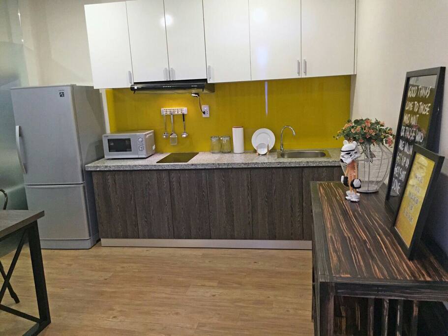 Kitchen with stove top and utensils for those who like to cook