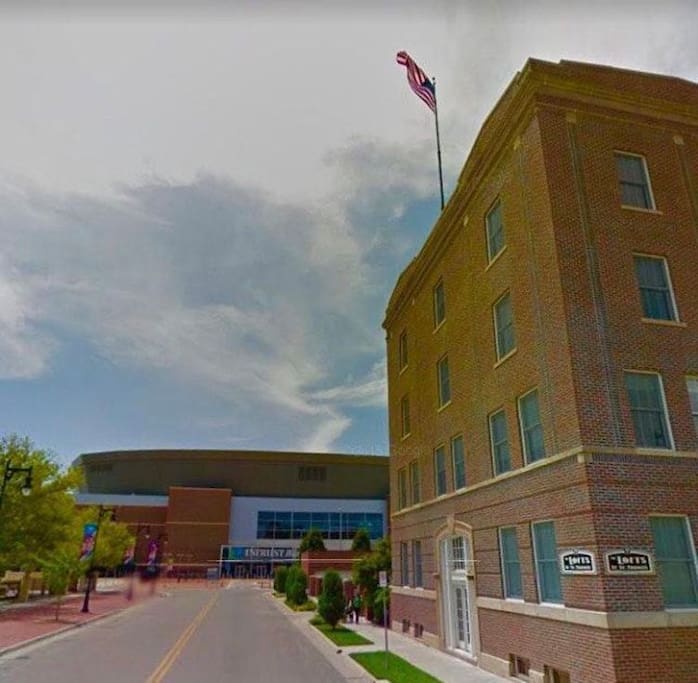 The condo building with the InTrust Bank Arena in the background. You'll be the for windows on the top floor.