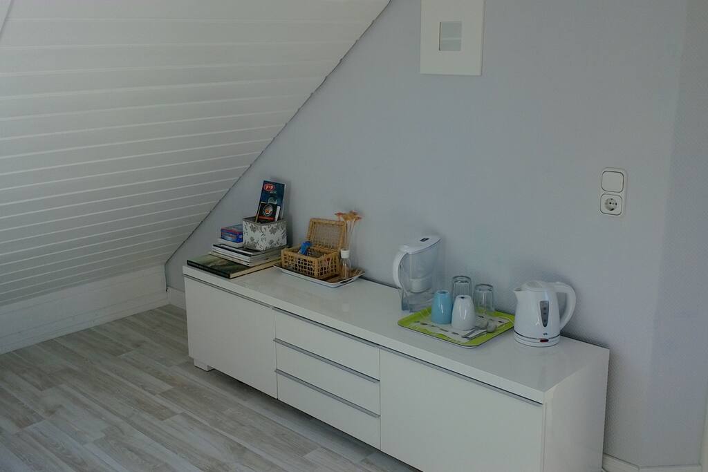 Small basic coffee, water and tea table. With additional storage space