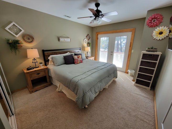 "The Wood Room" ~ KING guest room featuring wall mounted, 50" smart TV with streaming capability (all bedrooms have ceiling fans)
