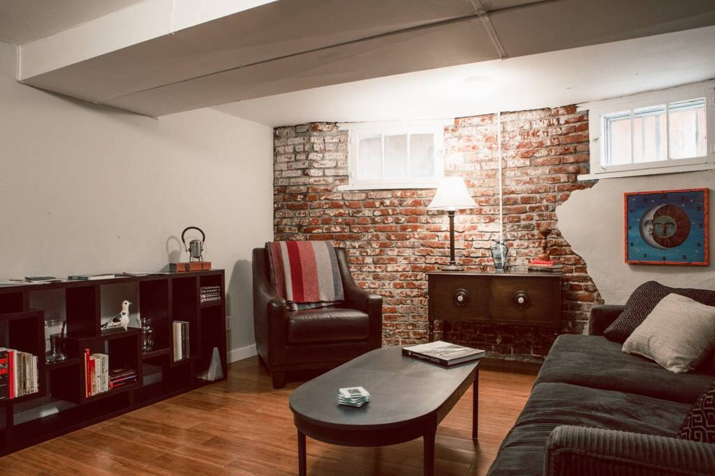 Cozy living room area with couch large enough to sleep on for extra guests