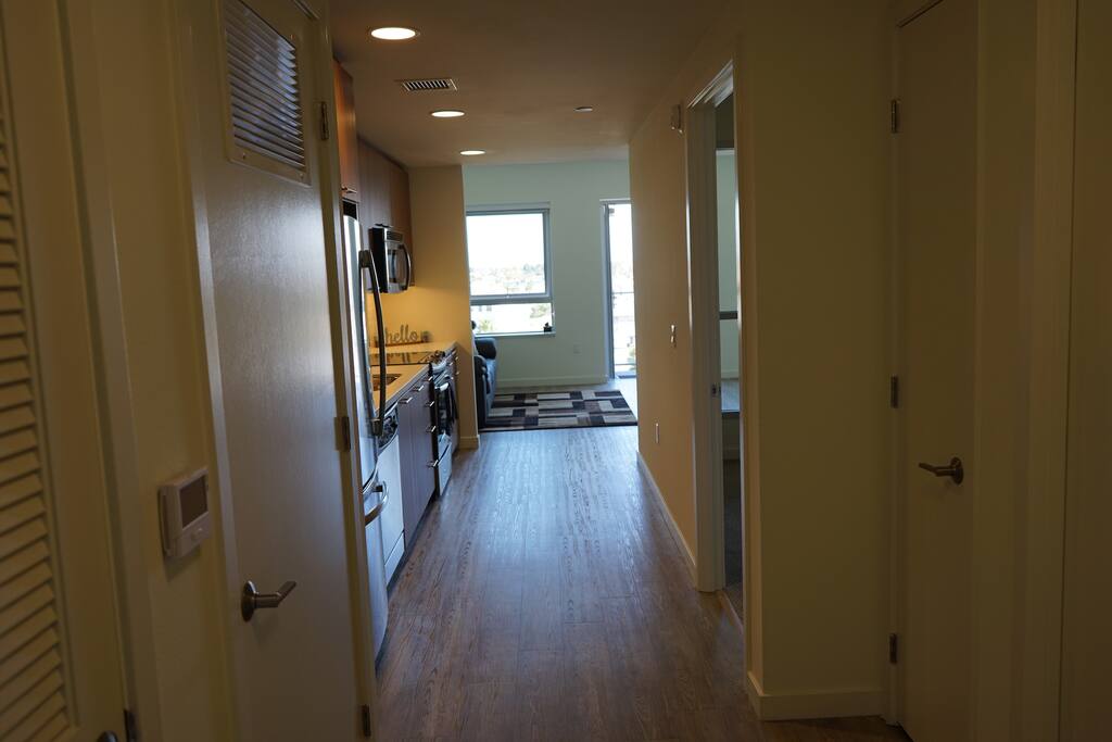 Welcome! Open Floor Plan Leading to the Living Room, Bedroom, Bathroom, and Patio Balcony.