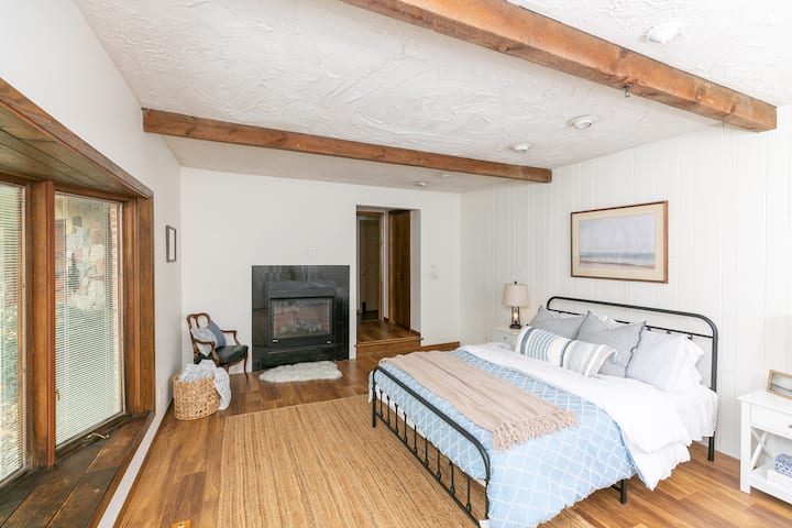 View of the window seat and fireplace. 