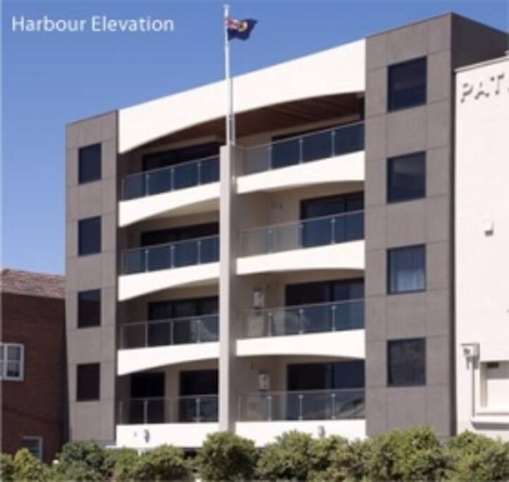 The new building at the rear looks to the port. The first white balcony on the left is that of apartment #3.