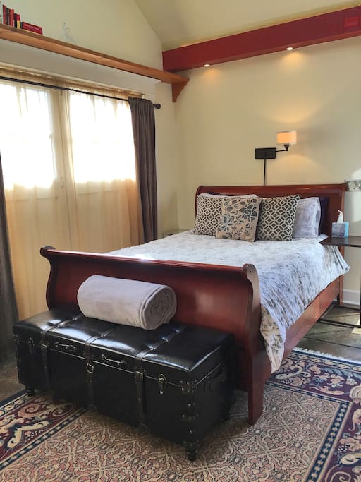 Queen-sized sleigh bed on the main floor.